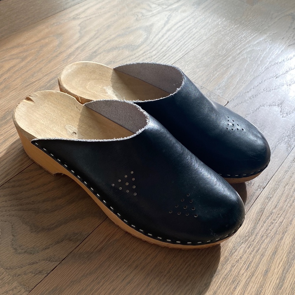 Black leather clogs